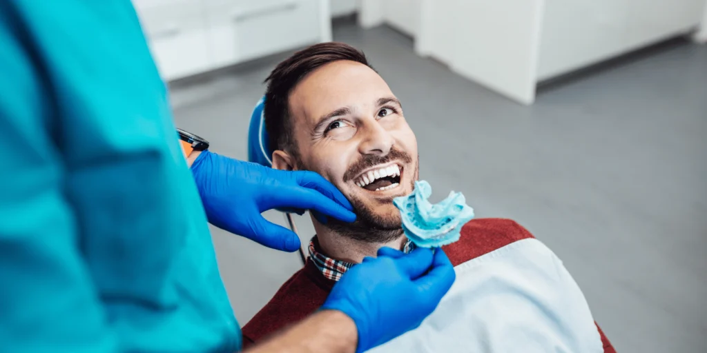 Smilodon Dental + Implants - Happy Adult